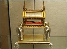 The above photograph shows an example of a _________________. a. reliquary c. deity-example-1