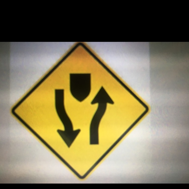 What does this sign mean? A. Side road is ahead B. Stay on the right side of the roadway-example-1