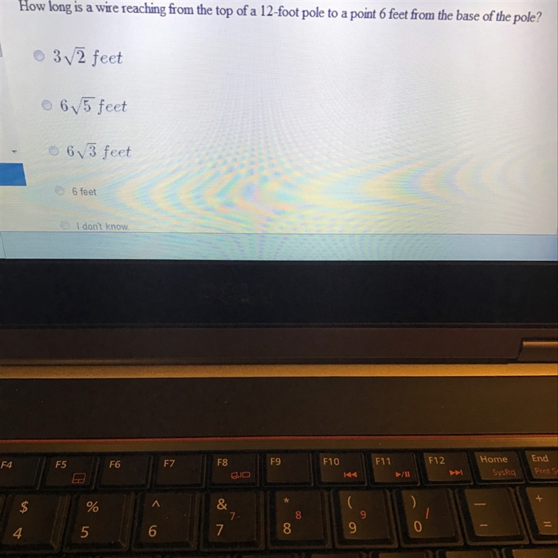 How long is a wire reaching from the top of a 12-foot pole to a point 6 feet from-example-1