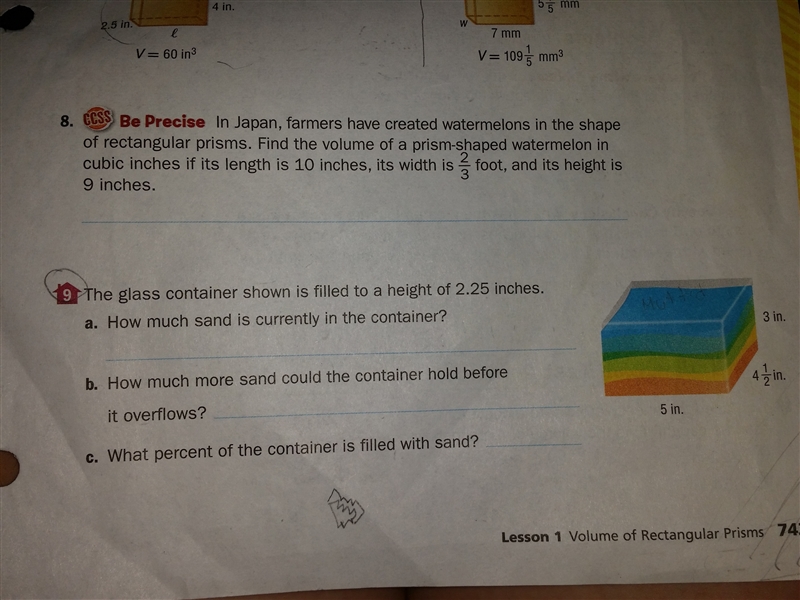 The glass container shown is filled to a height of 2.25 inches. How much sand is currently-example-1