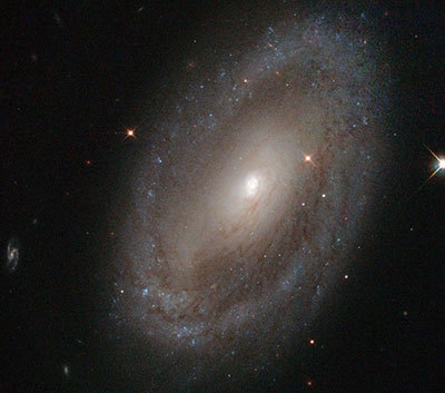 What type of galaxy is pictured below? irregular spiral lens elliptical-example-1