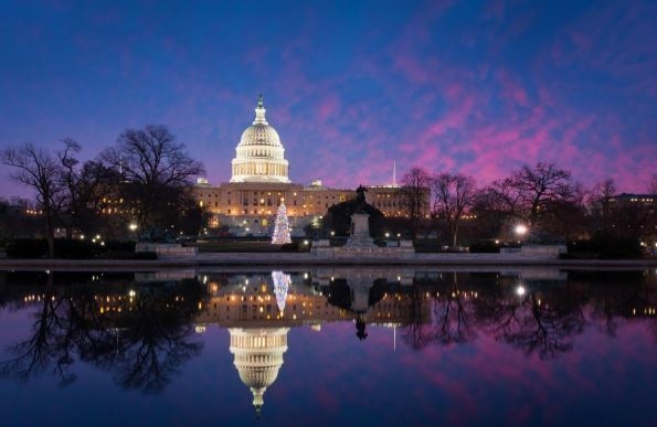 On a beautiful night in Washington D.C., you see a mirror image of US Capitol and-example-1