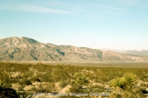 What landform caused by water erosion and deposition is shown in the image? A) Flood-example-1