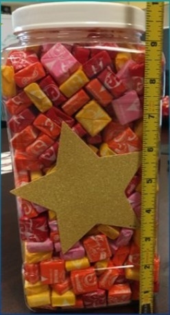 Hey Guys!! I need help big time! How many starburst do you guys think is in this container-example-1