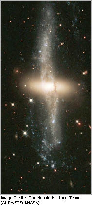 WHAT KIND OF GALAXY IS THIS??? A) Irregular B) Elliptical C) Spiral D) Barred spiral-example-1