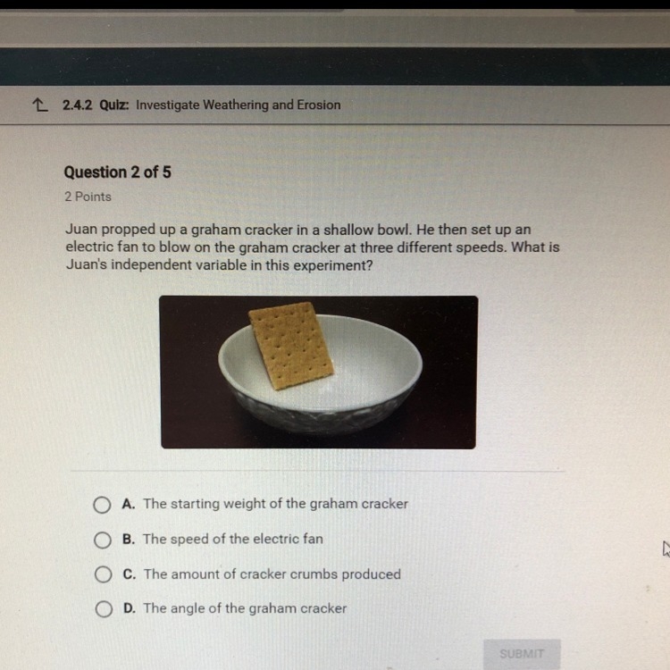 Juan propped up a graham cracker in a shallow bowl. He than set up an electric fan-example-1