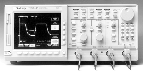 Two electronics technicians are looking at the piece of testing equipment shown in-example-1