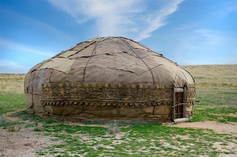 This photo shows a tent-like home carried by the Mongols from place to place.-example-1