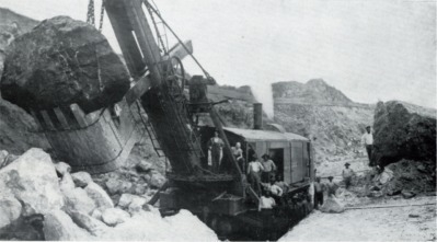 The photograph below was taken during construction of the Panama Canal. What does-example-1