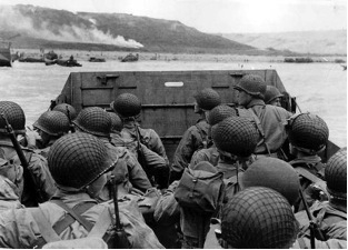 The photograph below was taken in 1944: Photograph from the Normandy Invasion, June-example-1