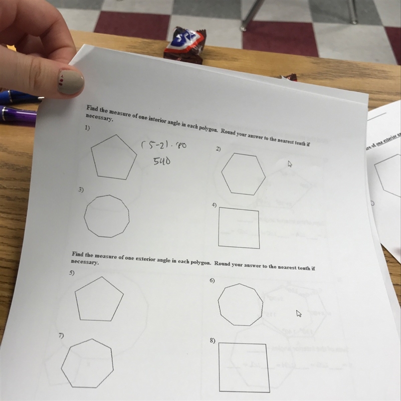 Find the measurement of one interior angle in each polygon. Round your answers to-example-1