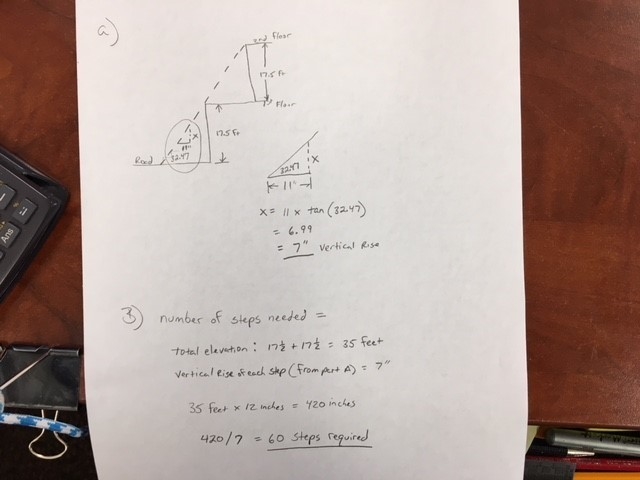 An outdoor staircase has a total vertical elevation of 17.5 feet from the road level-example-1