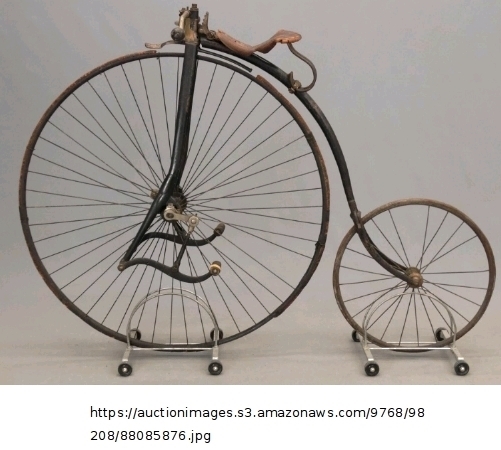 An old-fashioned bicycle has two differently sized wheels. The circumference of the-example-1