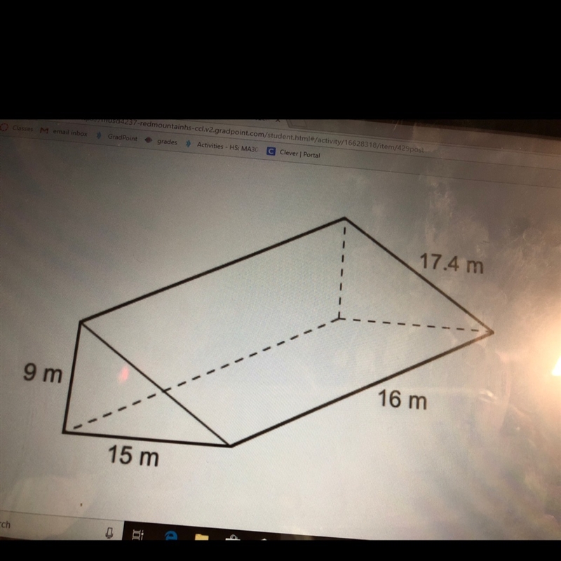 To the nearest whole number what is the surface area of the right triangular prism-example-1