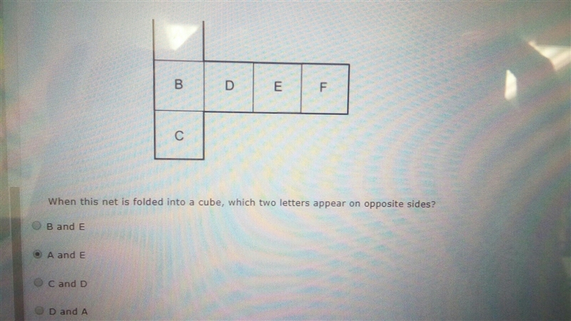 When this net is folded into a cube, which two letters appear on opposite sides-example-1