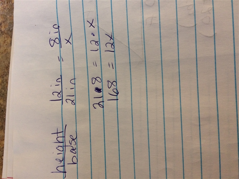 Julio considers the reduction of the triangle. 12 in height 21 in base and 8 in height-example-1