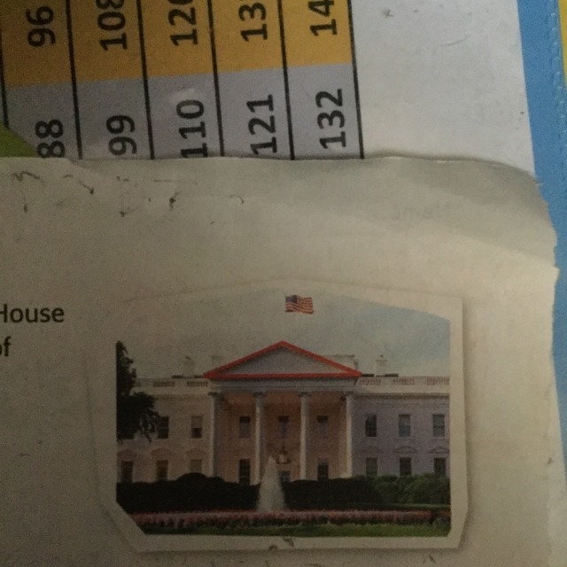 Look at the triangle on the top of the White House in the photo. Describe the size-example-1