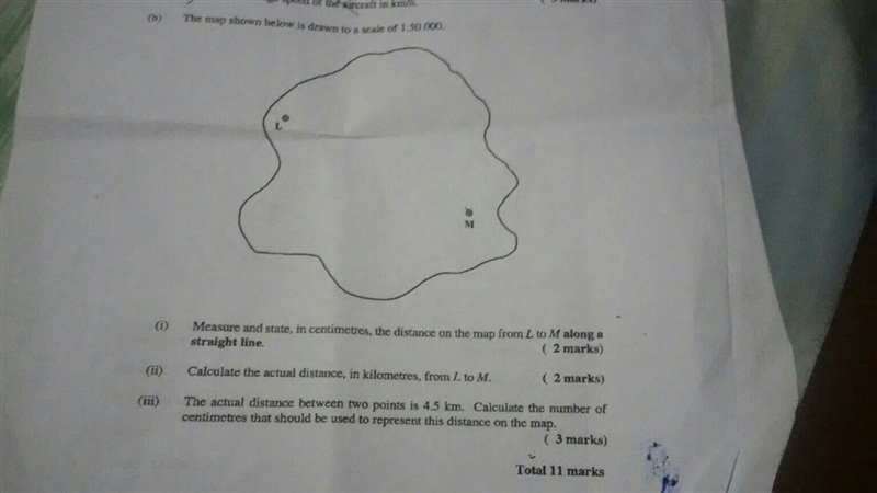 The map shown is scale of 1:50 000 1) measure and state in centimeters the distance-example-1