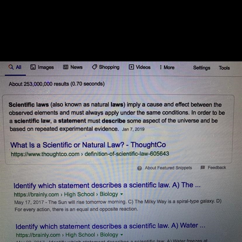 Es - Identify which statement describes a scientific law.-example-1