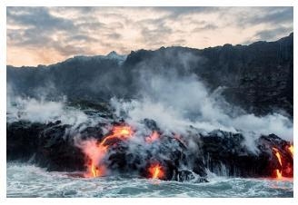 This image shows a volcanic eruption in Hawaii with lava flowing into the sea. Which-example-1