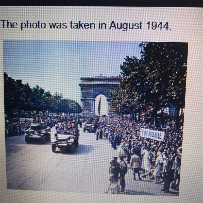 What event does the photo show? A. The allied D-Day landings B. German Troops entering-example-1