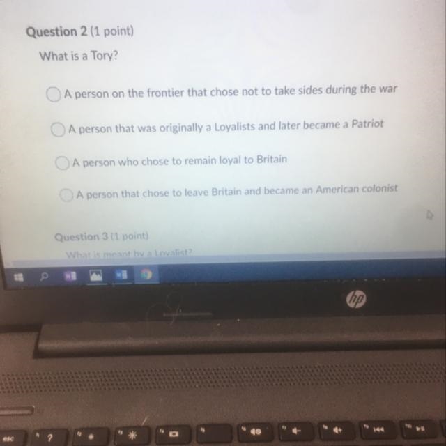 Question 2 (1 point) What is a Tory? A person on the frontier that chose not to take-example-1