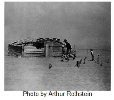 This photograph was taken in the Dust Bowl during the 1930s. (PICTURE HERE) The photograph-example-1