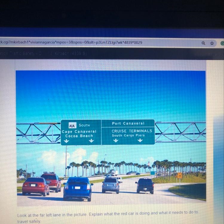 Look at the far left lane in the picture explain what the red car is doing and what-example-1