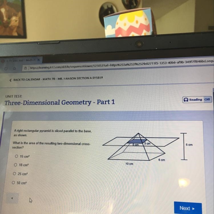 A right rectangular pyramid is sliced parallel to the base, as shown What is the area-example-1