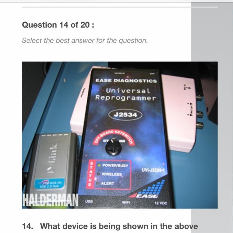 What device is being shown in the above photograph? A. Factory scan tool B. Generic-example-1