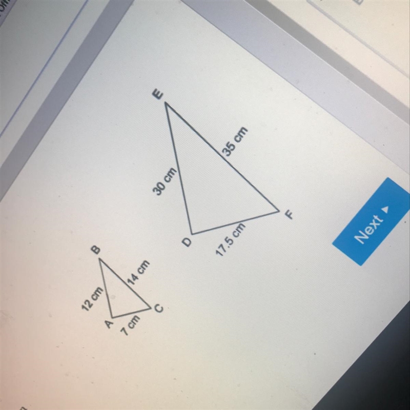 Are the triangles similar if so what postulate or Theorem proves their Similarity-example-1