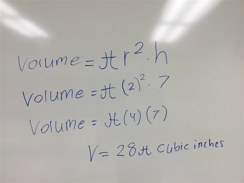 What is the volume of a cylinder with a height of 7 in. and a radius of 2 in.? Provide-example-1