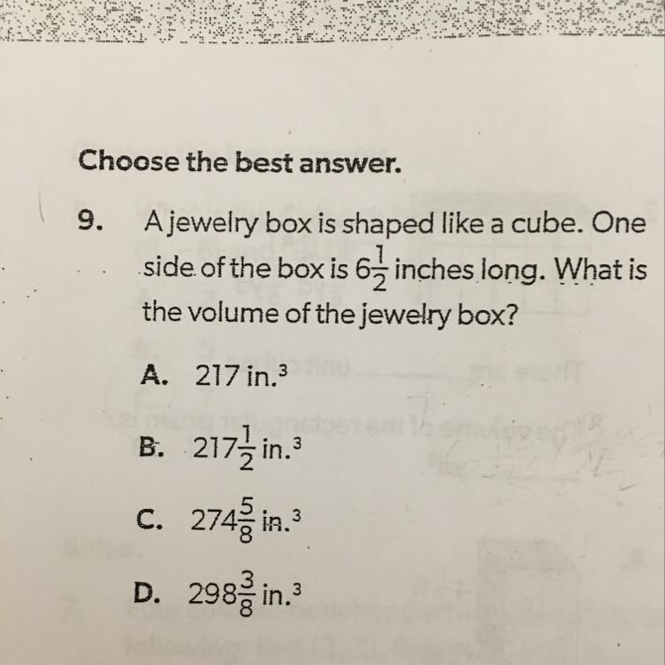 A jewelry box is shaped like a cube. One side of the box is 6 and 1/2 inches long-example-1