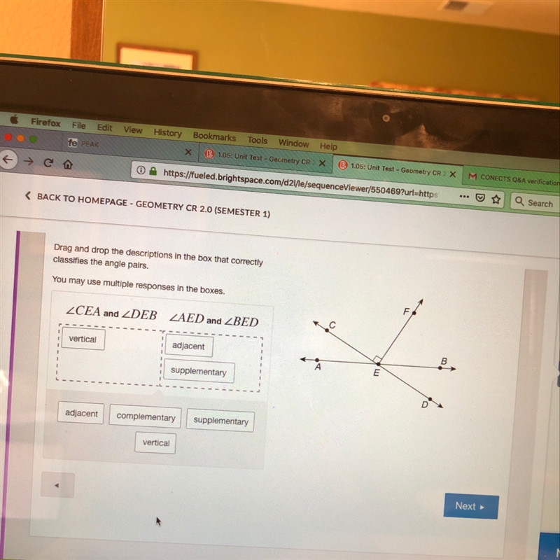 Drag and drop descriptions in the box that correctly classifies the angle pairs you-example-1