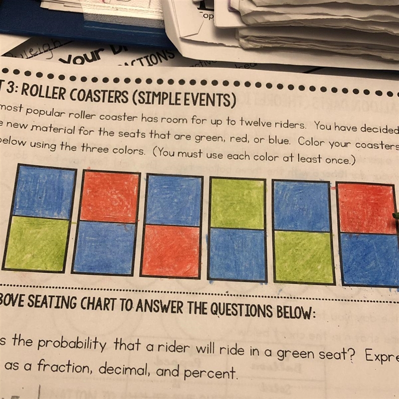 What is the probability that a rider will ride in a green, red, or blue seat? Express-example-1