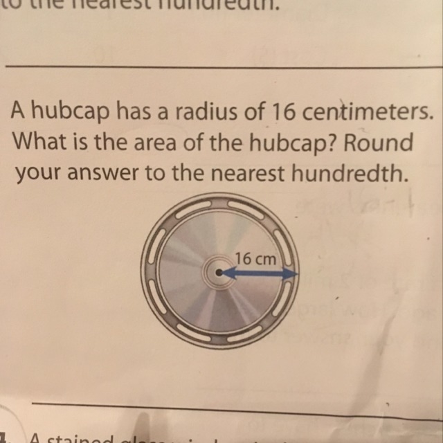 A hubcap has a radius of 16cm.What is the area of the hubcap?Round your answer to-example-1