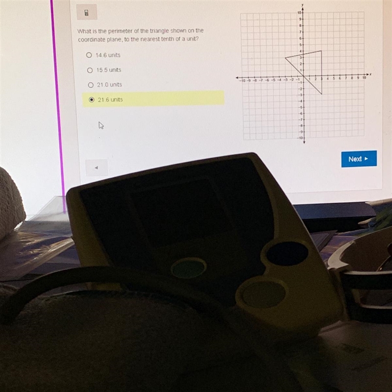 What is the perimeter of the triangle shown on the coordinate plane to the nearest-example-1