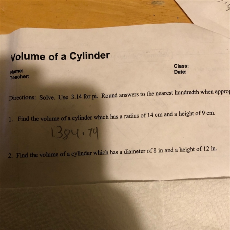 Find the volume of a cylinder which has a diameter of 8 in and a height of 12 in.-example-1