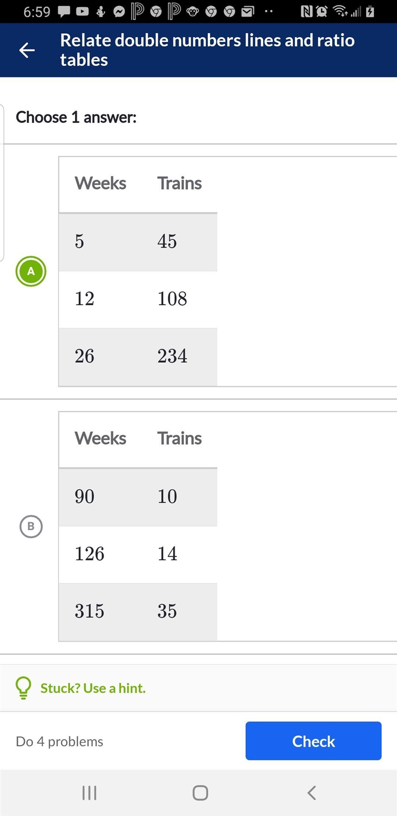 Which table represents the rate of irene building model trains?-example-2