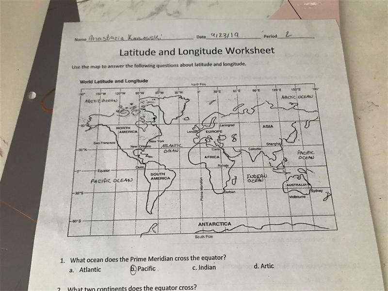 On what continent would you find the place with the latitude of 20* N and a longitude-example-1