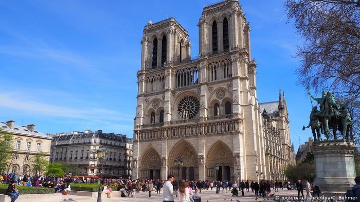 The Notre Dame Cathedral in Paris, France. The cathedral is smaller in height but-example-1