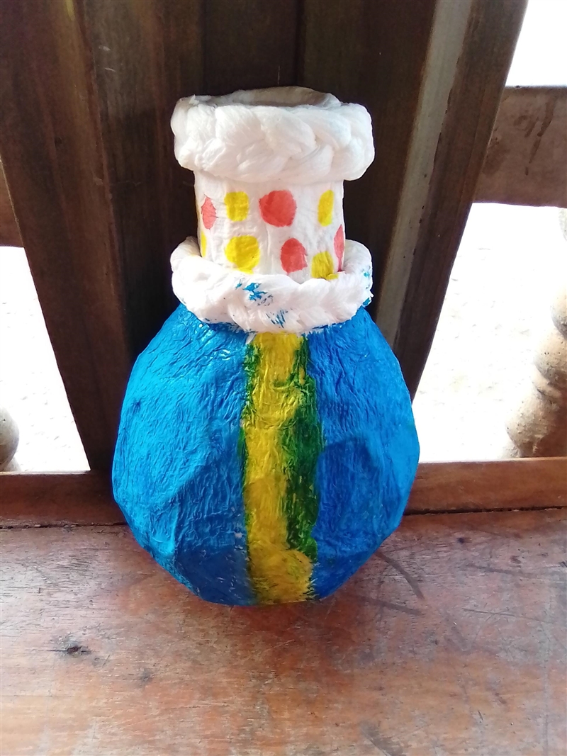 Hi. My cousin did a paper mache vase and isn't sure on the color to use for the white-example-1