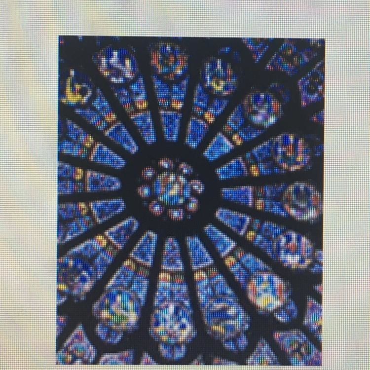 What type of stained glass window is this? A.pointed arch B.rounded arch C.rose D-example-1