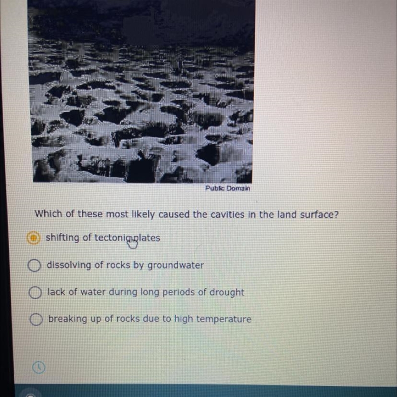 Which of these most likely caused the cavities in the land surface?-example-1