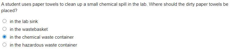 A student uses paper towels to clean up a small chemical spill in the lab. Where should-example-1