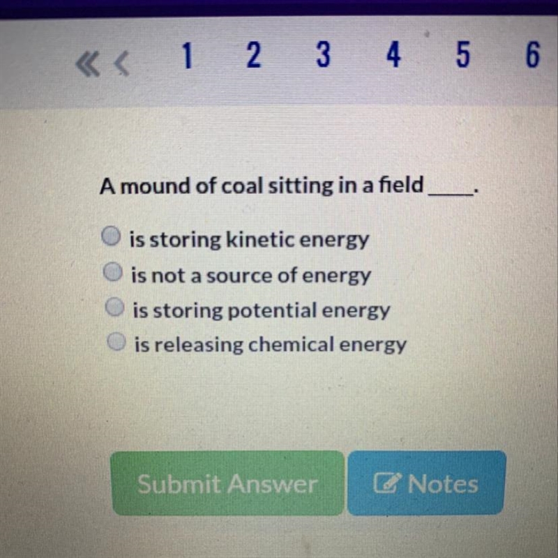 “A mound of coal sitting in a field ____."-example-1