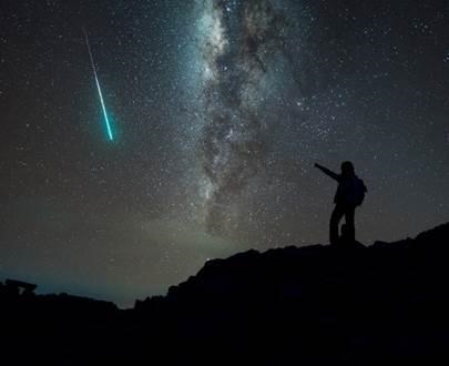 During an evening hike, you see a shooting star just like the one pictured here. In-example-1