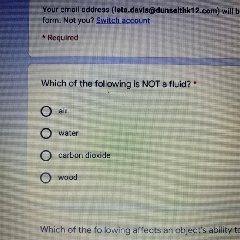 Which of the following is not a fluid? air, water, carbon dioxide, or wood-example-1