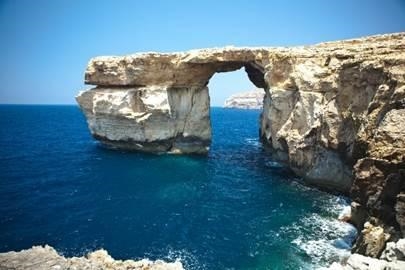 This image shows a sea arch. How did this sea arch most likely form? A. It formed-example-1