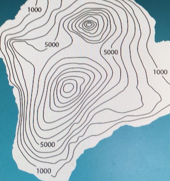 The volcanoes can be seen on the topographic map as tall peeks. How many volcanic-example-1